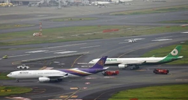 تأجيل عدد من الرحلات الجوية بعد تصادم طائرتين في مطار هانيدا الياباني